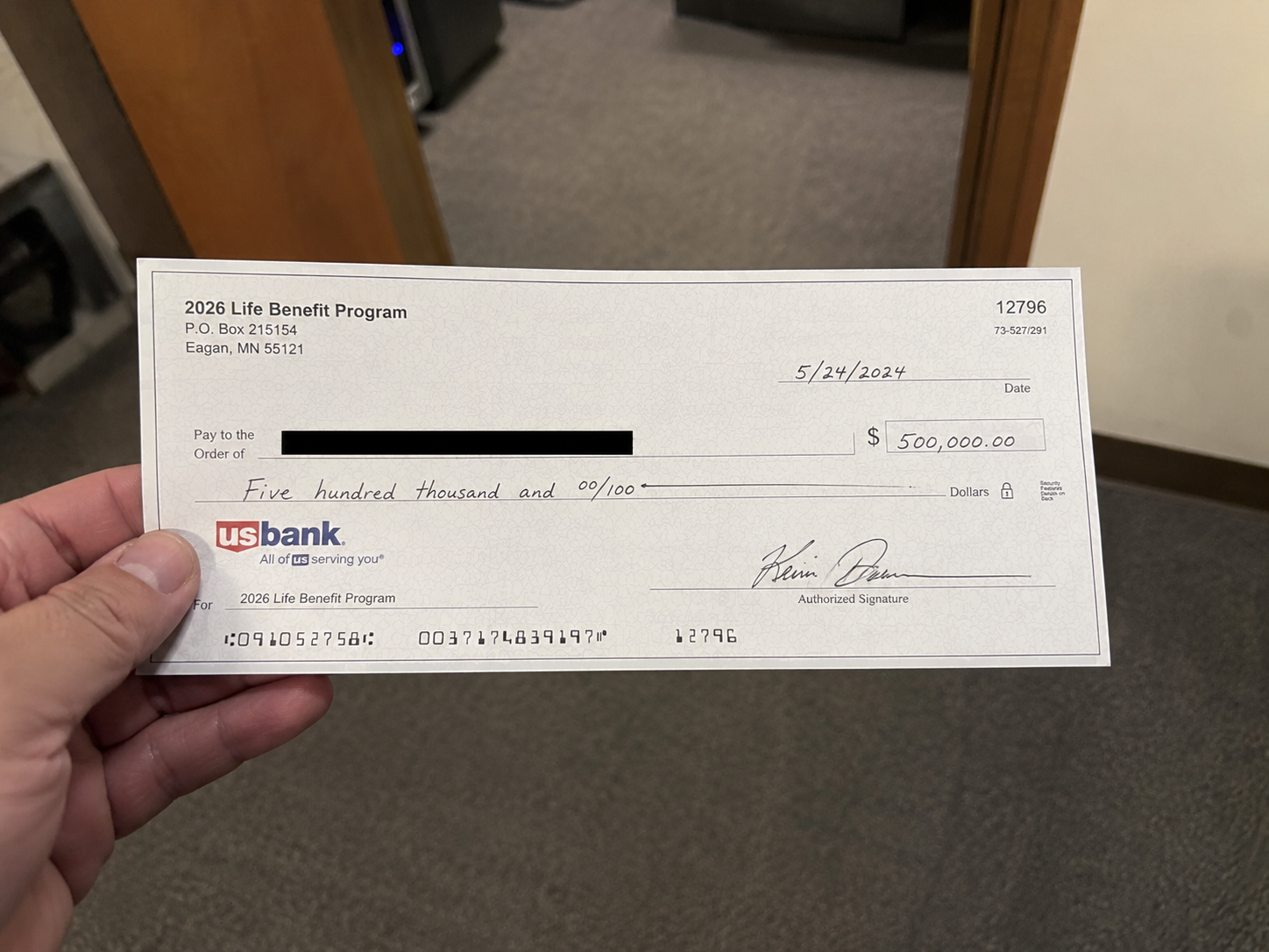 Life insurance benefit check example
